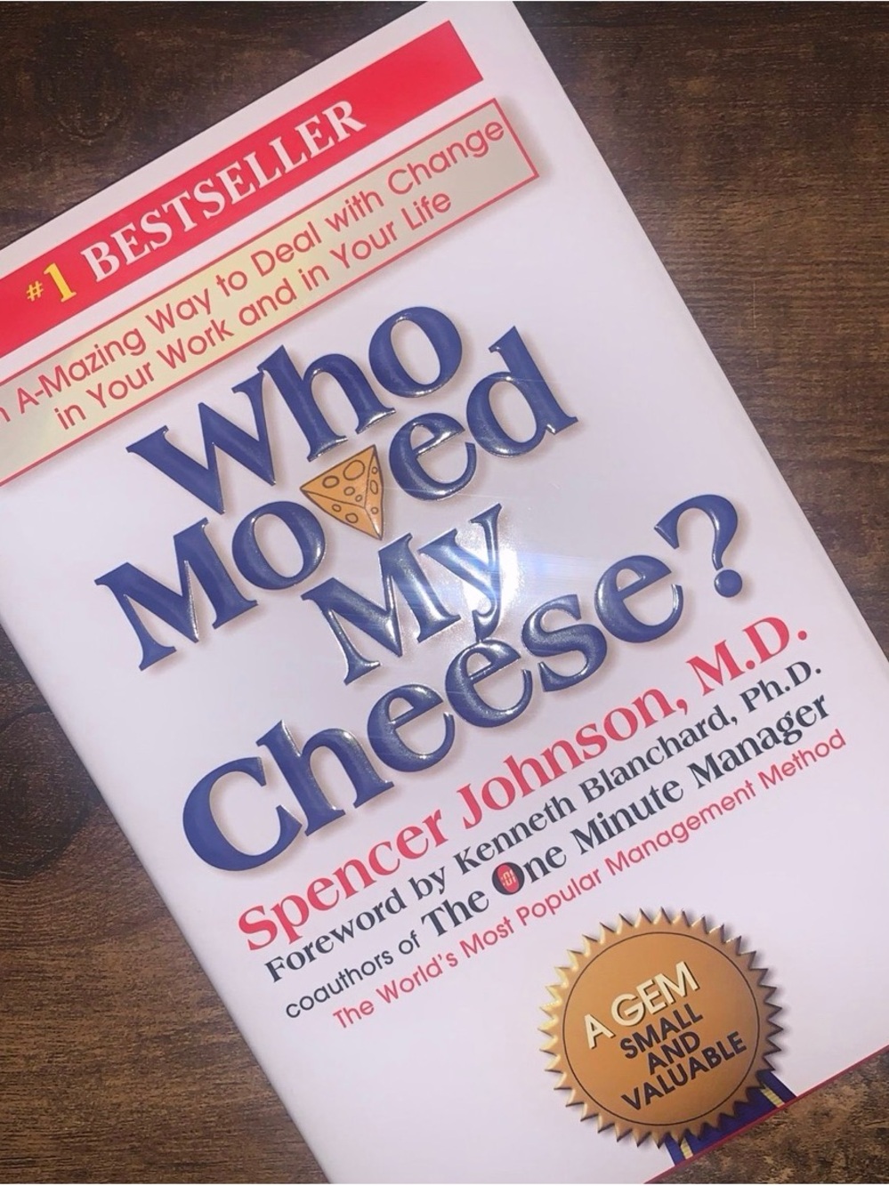 "Who Moved My Cheese?" by Spencer Johnson, a motivational book